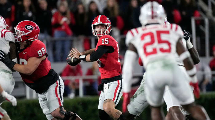 Georgia quarterback Carson Beck (15) throws from the pocket during the first half of a game against Ole Miss.